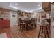 Charming dining area with hardwood floors, wooden table set, and ample storage at 1668 Macy Ln, Lawrenceville, GA 30043