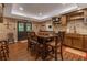 Cozy dining area with hardwood floors, a rustic table set, and natural wood accents at 1668 Macy Ln, Lawrenceville, GA 30043