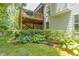 Two-story deck and lush landscaping with a mulch bed accent this charming home at 1668 Macy Ln, Lawrenceville, GA 30043