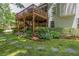 Multi-level deck, brick patio and beautiful landscaping complete this lovely yard at 1668 Macy Ln, Lawrenceville, GA 30043