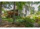 Charming home with multi-level deck, lovely landscaping, and beautiful mature trees at 1668 Macy Ln, Lawrenceville, GA 30043