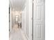 Hallway is painted a neutral color and features neutral carpet and white doors and trim at 1668 Macy Ln, Lawrenceville, GA 30043