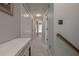 Second floor hallway is painted a neutral color and features neutral carpet at 1668 Macy Ln, Lawrenceville, GA 30043