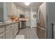 Modern kitchen featuring stainless steel appliances and painted cabinets at 1668 Macy Ln, Lawrenceville, GA 30043