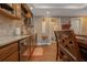 Modern kitchen with hardwood floors, granite countertops, and stainless steel appliances at 1668 Macy Ln, Lawrenceville, GA 30043