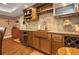 Stylish kitchen boasts wood cabinets, granite countertops, and stainless steel appliances at 1668 Macy Ln, Lawrenceville, GA 30043