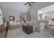Inviting living area with a large sectional sofa, stylish decor, and open access to other living areas at 1668 Macy Ln, Lawrenceville, GA 30043