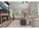 Spacious living room with a cozy fireplace, comfortable seating, and stylish decor for relaxing or entertaining at 1668 Macy Ln, Lawrenceville, GA 30043