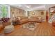 Bright living room with hardwood flooring, a plush sofa, and decorative rug at 1668 Macy Ln, Lawrenceville, GA 30043