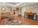 Inviting living room featuring a sofa, hardwood floors, and natural light at 1668 Macy Ln, Lawrenceville, GA 30043