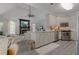 Bright kitchen open to a living space featuring a fireplace and vaulted ceilings at 1668 Macy Ln, Lawrenceville, GA 30043