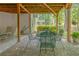 Relaxing brick patio area with lush greenery, offering a serene outdoor retreat at 1668 Macy Ln, Lawrenceville, GA 30043
