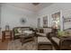 Charming screened porch with wicker seating, offering a perfect spot for relaxation at 1668 Macy Ln, Lawrenceville, GA 30043