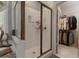 A glass shower with a door is conveniently located next to a walk-in closet at 1668 Macy Ln, Lawrenceville, GA 30043