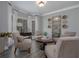 Cozy sitting room with bay window, neutral furniture, and ample natural light for relaxation and conversation at 1668 Macy Ln, Lawrenceville, GA 30043
