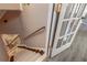 Beautiful staircase with carpeted steps and a stained wood railing at 1668 Macy Ln, Lawrenceville, GA 30043