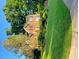 Inviting two-story brick home featuring manicured lawn, mature trees, and attractive curb appeal at 3119 Grant Way, East Point, GA 30344