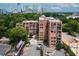 Apartment building with trees and city skyline at 3235 Roswell Ne Rd # 702, Atlanta, GA 30305