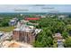 Aerial view of Buckhead Village Lofts in Atlanta surrounded by trees, gyms, restaurants, and other stores at 3235 Roswell Ne Rd # 702, Atlanta, GA 30305