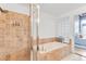 Bathroom featuring large soaking tub and separate tiled shower at 3235 Roswell Ne Rd # 702, Atlanta, GA 30305