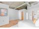 Bright bedroom with hardwood floors, modern lighting, and neutral decor creating a peaceful retreat at 3235 Roswell Ne Rd # 702, Atlanta, GA 30305