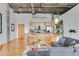 Contemporary kitchen featuring light wood cabinets, stainless steel appliances, and a breakfast bar with seating at 3235 Roswell Ne Rd # 702, Atlanta, GA 30305
