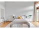 Bright primary bedroom showcasing neutral tones, minimalist design, and hardwood flooring at 3235 Roswell Ne Rd # 702, Atlanta, GA 30305