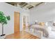 Bright bedroom featuring a cozy bed, modern decor, and a glimpse into the ensuite bathroom at 3235 Roswell Ne Rd # 702, Atlanta, GA 30305