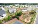 Aerial view of a community featuring houses, pool, playground, and well-manicured landscaping at 3410 Summerpoint Xing, Cumming, GA 30028