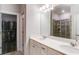 Elegant bathroom with double vanity, white marble countertops, and a glass-enclosed shower at 3410 Summerpoint Xing, Cumming, GA 30028