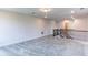 Spacious bonus room with plush gray carpet, ideal for entertainment or relaxation at 3410 Summerpoint Xing, Cumming, GA 30028