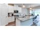 Modern kitchen with granite countertops, stainless steel appliances, and ample cabinet space for storage at 3410 Summerpoint Xing, Cumming, GA 30028