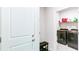 Functional laundry room equipped with modern black washer and dryer at 3410 Summerpoint Xing, Cumming, GA 30028