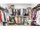Large walk-in closet with ample shelving and hanging space for organized storage at 3410 Summerpoint Xing, Cumming, GA 30028