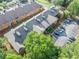 Apartment complex featuring lush landscaping, parking, and classic brick and gray exteriors in a wooded suburban setting at 705 Beaufort Cir, Duluth, GA 30096