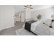 A comfortable bedroom boasts gray walls, wood-look flooring, a decorative rug, and comfortable bed at 705 Beaufort Cir, Duluth, GA 30096