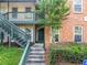 Building exterior with stairwell and natural landscaping at 705 Beaufort Cir, Duluth, GA 30096