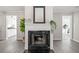 Elegant fireplace with a white mantel and dark tile, set against light gray walls and flooring at 705 Beaufort Cir, Duluth, GA 30096