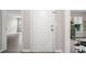 Bright entryway features a white front door and wood-look floors, leading into the living space at 705 Beaufort Cir, Duluth, GA 30096