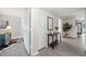 Inviting hallway with closets, modern decor, and wood-look floors leading to various rooms at 705 Beaufort Cir, Duluth, GA 30096