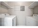 The laundry room features new appliances and built in shelving at 705 Beaufort Cir, Duluth, GA 30096