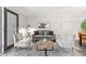 Comfortable living room with a modern gray sofa, stylish decor, and plenty of natural light at 705 Beaufort Cir, Duluth, GA 30096