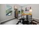 A simple office with multiple windows, gray walls, modern decor, and wood-look flooring at 705 Beaufort Cir, Duluth, GA 30096