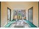 Enjoy this lovely sunroom complete with a rug, chairs, and access to the outside at 705 Beaufort Cir, Duluth, GA 30096