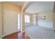 Spacious foyer with hardwood floors and a view into the dining room at 1575 Parkside Village Dr, Cumming, GA 30040