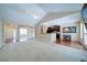 Living room with an open floor plan leads into dining and kitchen area at 1575 Parkside Village Dr, Cumming, GA 30040