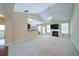 Open living room with vaulted ceiling, fireplace, and bar area for entertaining at 1575 Parkside Village Dr, Cumming, GA 30040