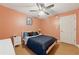 Bedroom with hardwood floors, a ceiling fan, and lots of natural light at 2031 Dennis Pl, Buford, GA 30519
