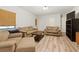 Neutral living room offers a comfortable seating arrangement, updated flooring, and natural light at 2031 Dennis Pl, Buford, GA 30519