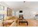 Bright living room with hardwood floors, a cozy fireplace, and lots of natural light at 2031 Dennis Pl, Buford, GA 30519
